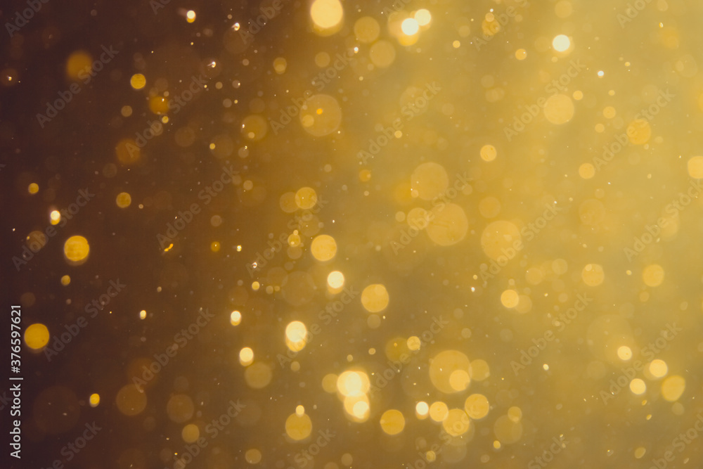 Dark Abstract Gold bokeh sparkle on black Dark Abstract Gold bokeh sparkle on black