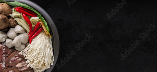 Japanese Sukiyaki in traditional Cast Iron Pot. Chabu sukiyaki, Japanese food. photo