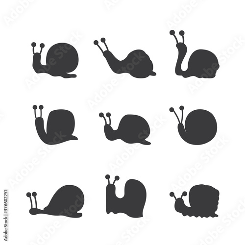 Cute funny cartoon snail black silhouettes set vector illustration isolated. photo