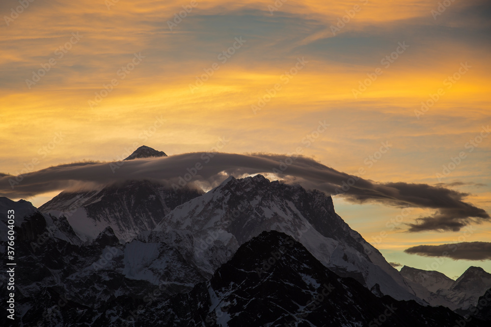 Picturesque colourful clouds over Mount Everest at sunrise. No people.