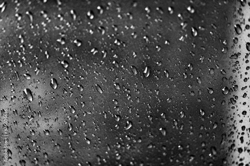 Rain texture drops on glass black background