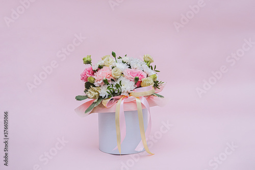 Bouquet of flowers  roses  eucalyptus  daisies  peonies in a round box hat. Composition gift vase of flowers for Valentine s day  mother s day  wedding  birthday.