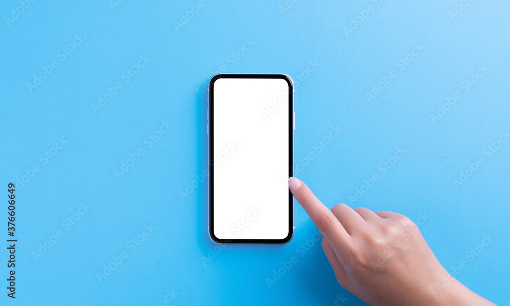 hand touching on phone white screen on blue background clipping path inside hand touching on phone white screen on blue background clipping path inside