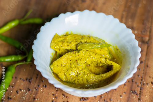 Famous Bengali Dish Hilsa/Ilish fish with poppy and mustard seed recipe. photo