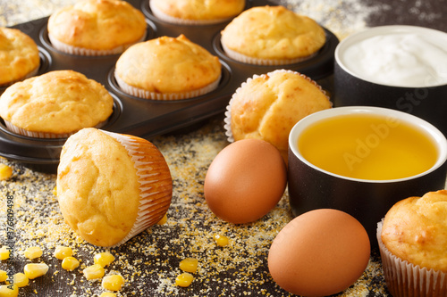 Wallpaper Mural Traditional corn muffins in a baking dish and ingredients close-up on the table. horizontal Torontodigital.ca