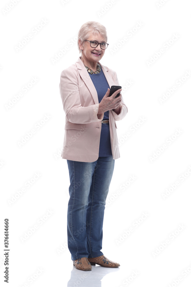 in full growth. senior woman is reading a conversation on her smartphone in full growth. senior woman is reading a conversation on her smartphone