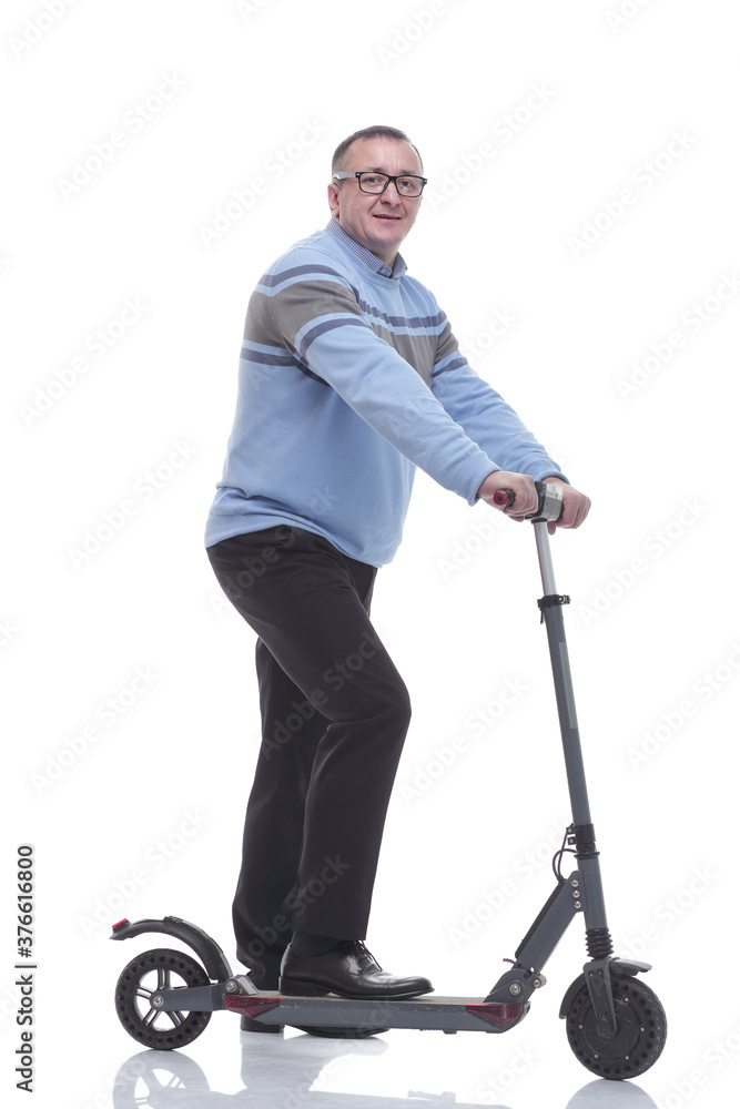 side view. successful modern man with electric scooter side view. successful modern man with electric scooter