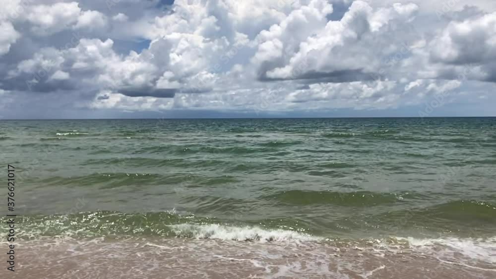slow motion of Tropical beach sea on sunny day with beautiful clouds on sky in the summer. Nature of the sea, Video Clip slow motion of Tropical beach sea on sunny day with beautiful clouds on sky in the summer. Nature of the sea, Video Clip