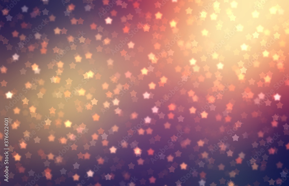 Star sparkles in bright light on yellow red purple colors background. Festive decor. Bokeh textured pattern.
