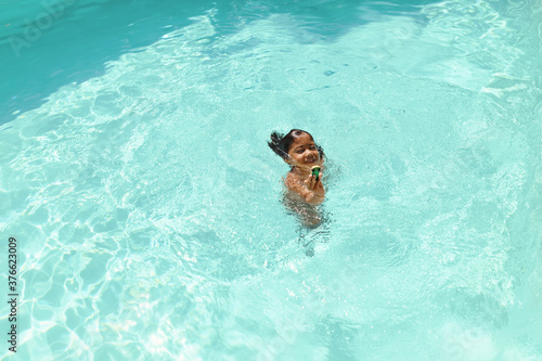 Boy In Swimming Pool. Summer Entertainment For Fun In Turquoise Water At Resort. Happy Wet Kid Enjoying Leisure On Vacation. Summer Activity As Lifestyle.