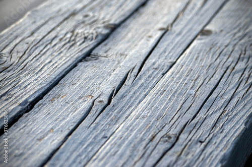 Gray boards with deep cracks, perspective