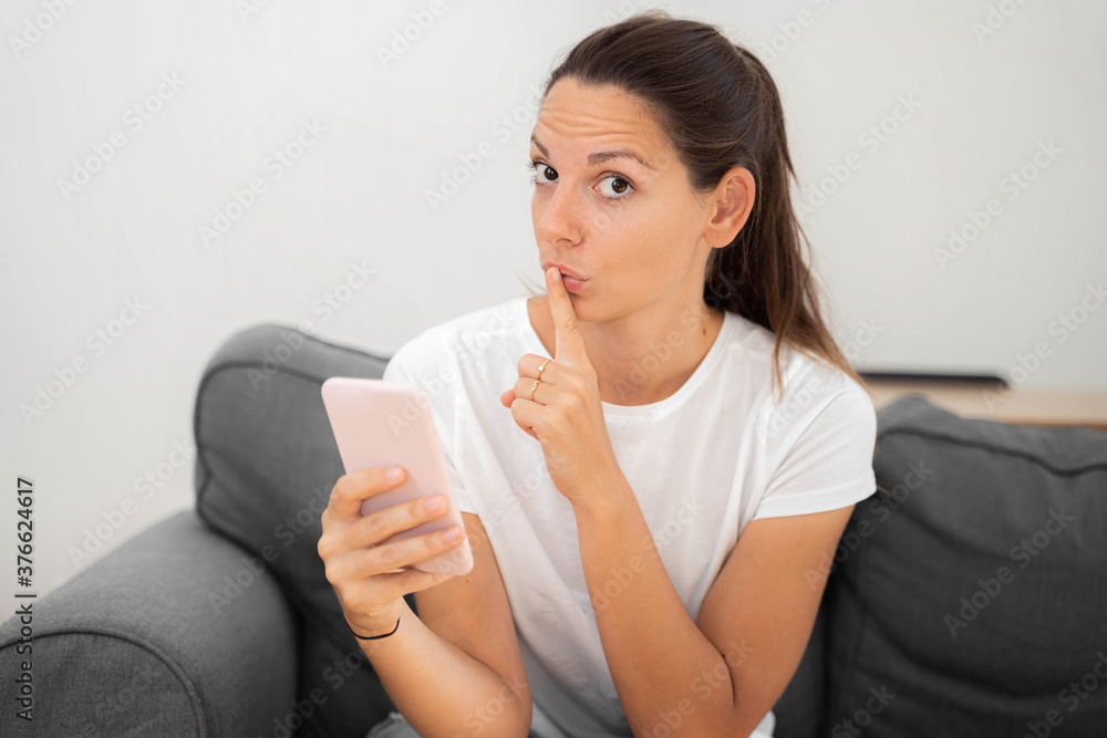 Young caucasian woman with phone. Censorship in internet. Young caucasian woman with phone. Censorship in internet.