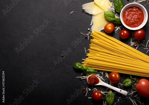 Spaghetti with parmesan, basil and tomato sauce, flat ley photo