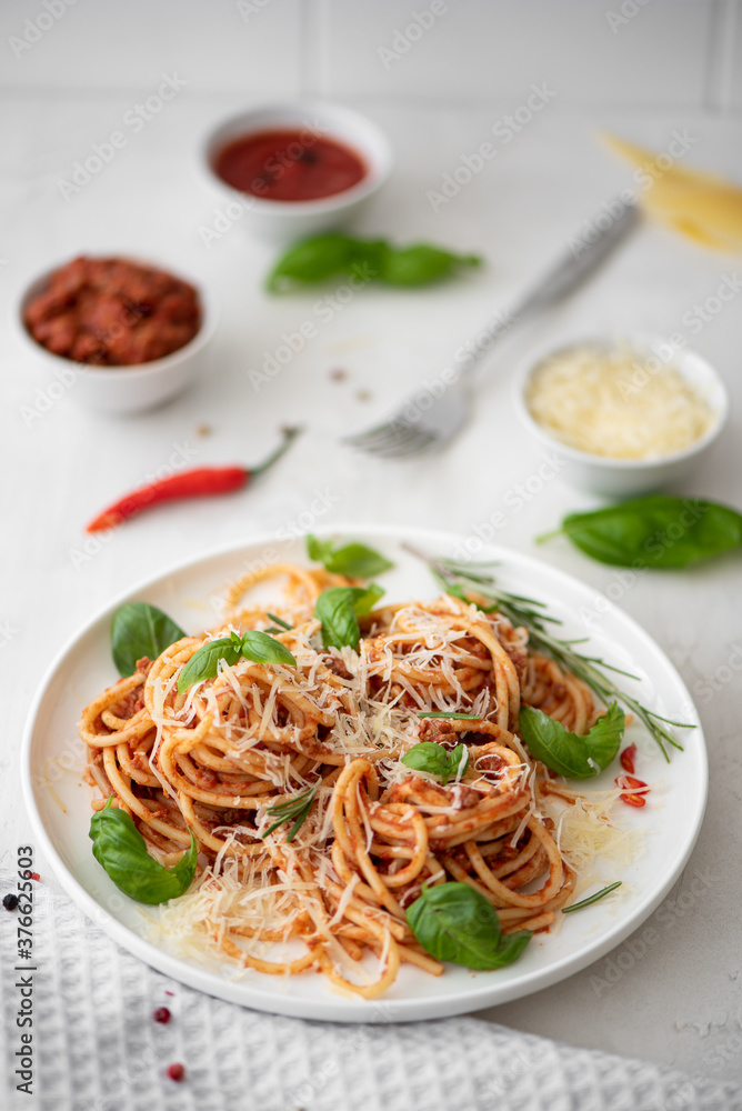 spaghetti bolognese with basil and parmesan