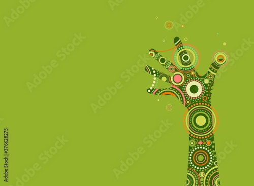 Fantasy painted hand with bright ethnic ornament of circles and dots.