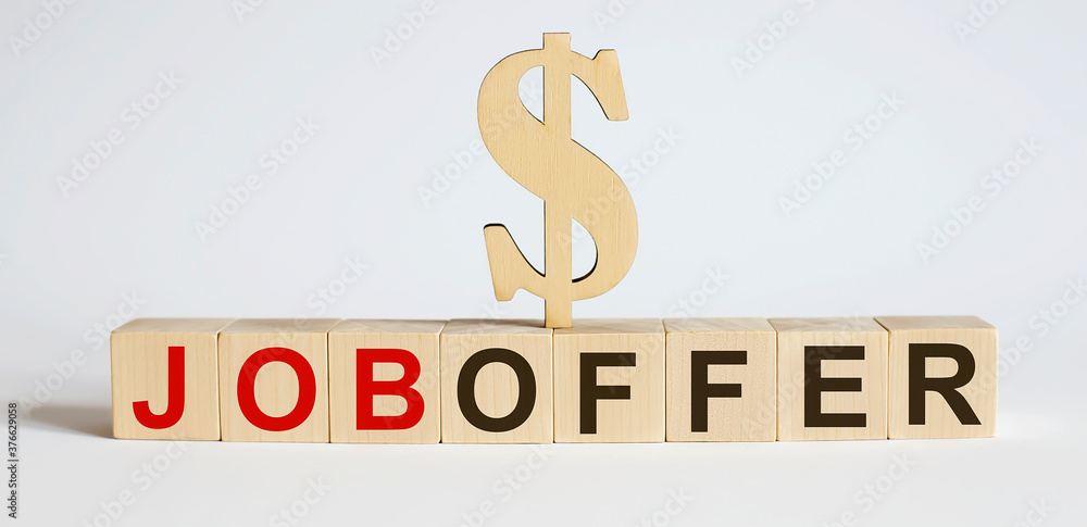 Text JOB OFFER on woodeen cube block, stock investment concept. Text JOB OFFER on woodeen cube block, stock investment concept.