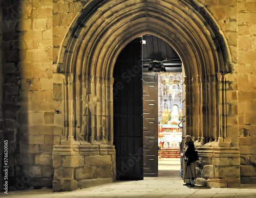 near door of the catholic cathedral at night