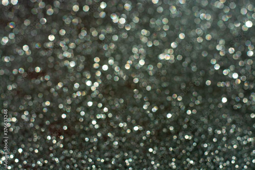 white bokeh abstract on a gray background, the concept of Christmas, new year, 2021. white bokeh abstract on a gray background, the concept of Christmas, new year, 2021.