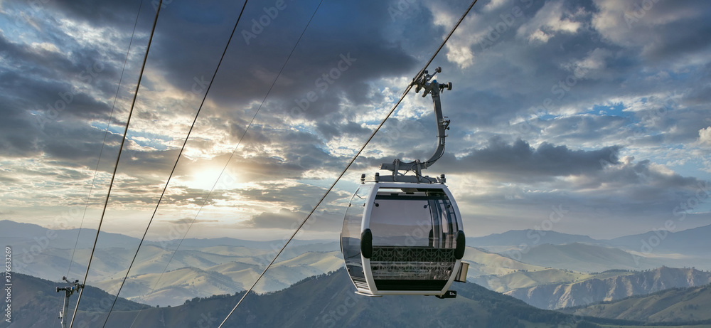 High angle shot of cableway on a cityscape and landscape background