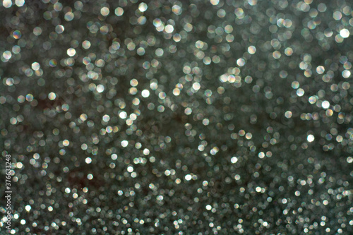 white bokeh abstract on a gray background, the concept of Christmas, new year, 2021.