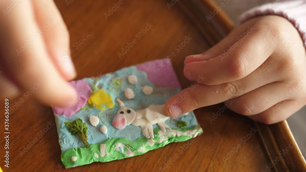 baby girl making plasticine unicorn baby girl making plasticine unicorn