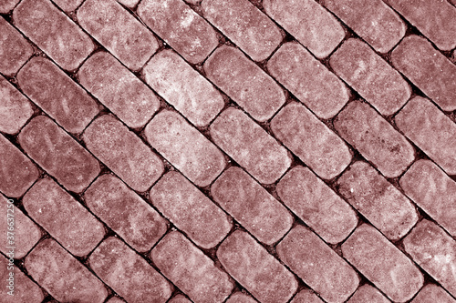 Stone walkway and cobbled road. red toned