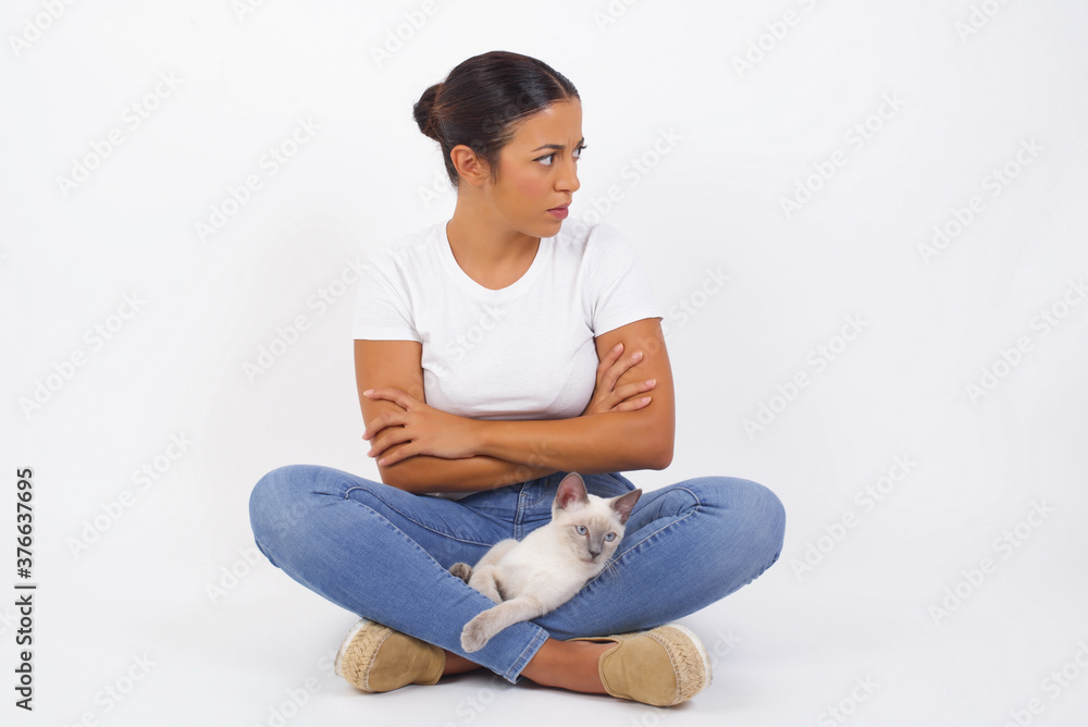 Closeup portrait displeased pissed off angry grumpy pessimistic woman with bad attitude, arms crossed looking sideways. Negative human emotion facial expression feelings Closeup portrait displeased pissed off angry grumpy pessimistic woman with bad attitude, arms crossed looking sideways. Negative human emotion facial expression feelings