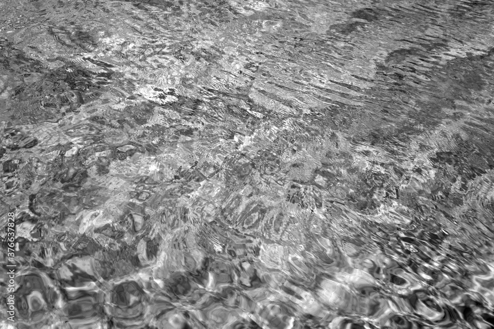 Fototapeta premium Water pattern in swimming pool in black and white
