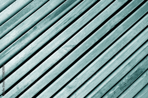 Weathered wooden planks texture with gaps. cyan toned