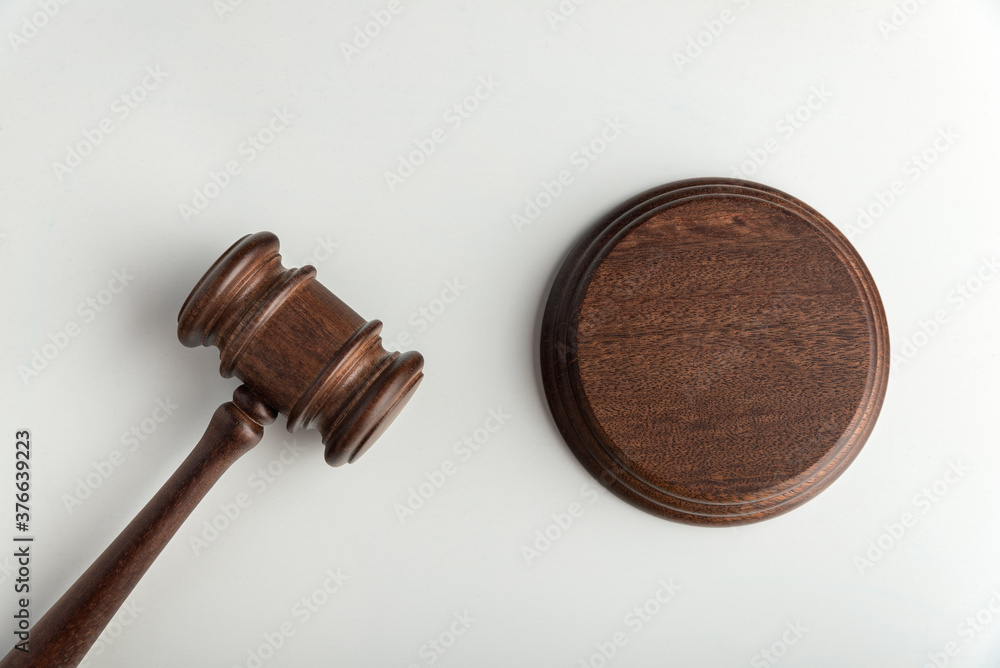 Wooden judge gavel and sound Board. Top view. Auction. White background Wooden judge gavel and sound Board. Top view. Auction. White background