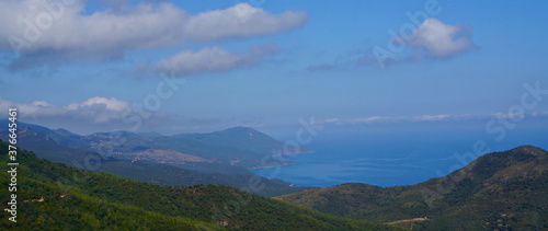 panoramic view of the mountains with blue sky