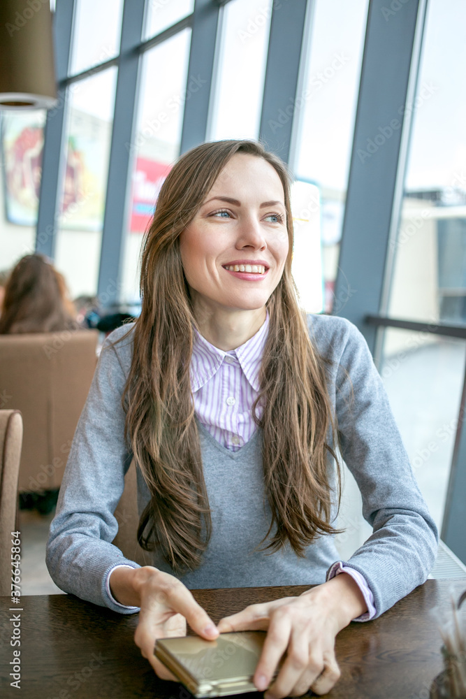 Portrait of a young woman in cafe Portrait of a young woman in cafe