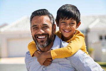 Father and son smiling together