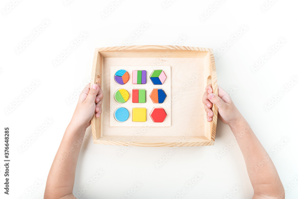 Obraz premium Montessori material. Hand of a child.