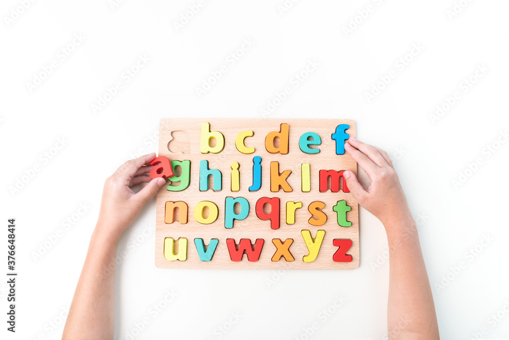 Montessori material. Hand of a child. Montessori material. Hand of a child.