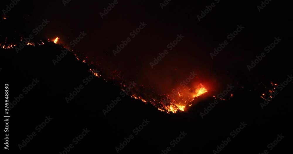 Dark night mountain wild forest fire blaze. Intense man caused wild and ...