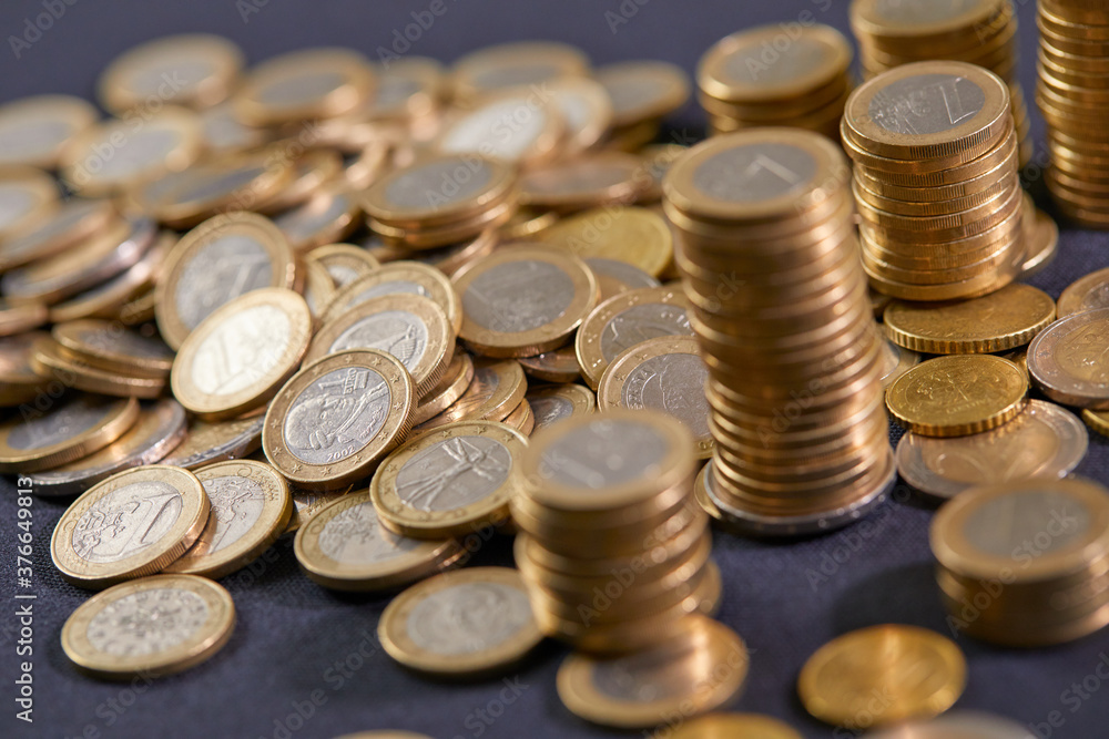 Stock Photo - Euro coins. Euro money. Euro currency.Coins stacked on each other in different positions. Money concept Stock Photo - Euro coins. Euro money. Euro currency.Coins stacked on each other in different positions. Money concept