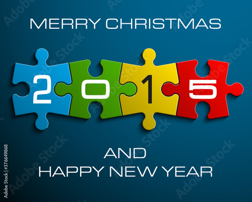 Figures 2015 on the colorful puzzles on a blue background
