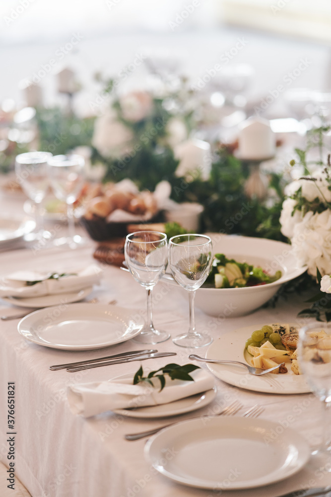 Table set for an event party or wedding reception. Banquet table design Table set for an event party or wedding reception. Banquet table design