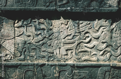 Closeup of carved Maya figures in a Mayan temple in Chichen Itza, Yucatan, Mexico photo