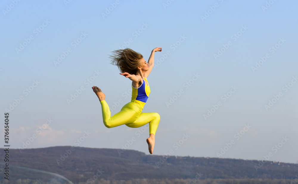 freedom is life. sport in motion. full of energy. Attractive young sporty woman is workout in outdoor gym. morning exercise. ukrainian national gymnast. Acrobatics and gymnastics. girl jumping high freedom is life. sport in motion. full of energy. Attractive young sporty woman is workout in outdoor gym. morning exercise. ukrainian national gymnast. Acrobatics and gymnastics. girl jumping high