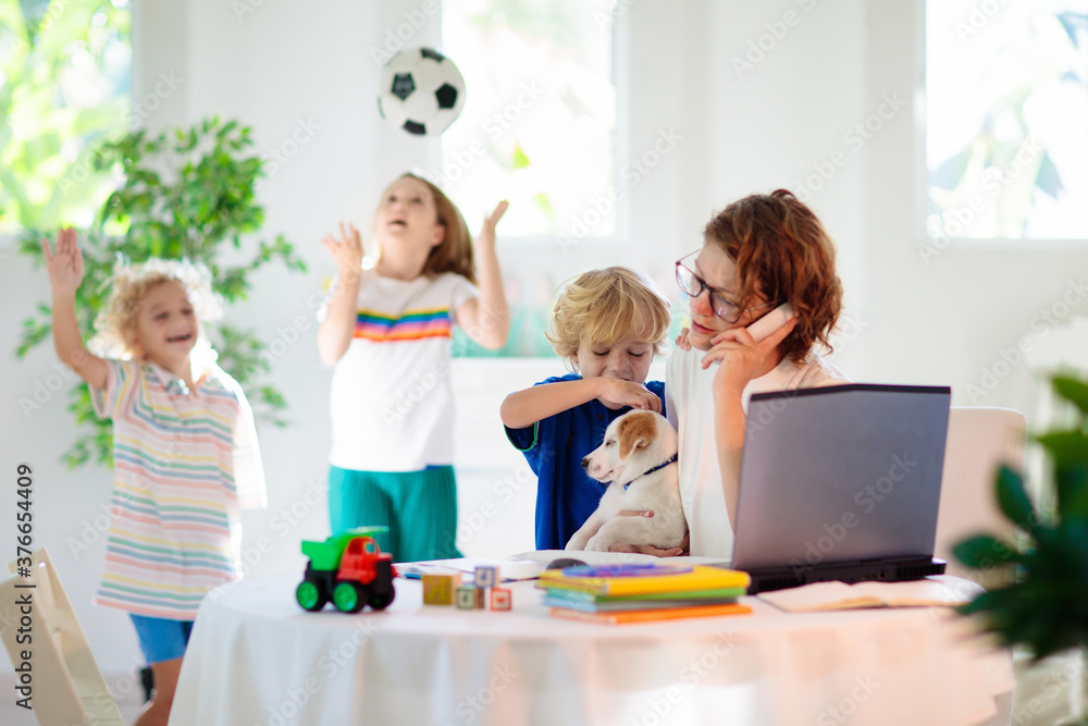 Mother working from home with kids. Quarantine. Mother working from home with kids. Quarantine.