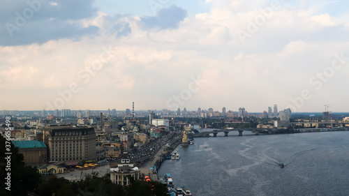 Top view of the old historical part of the city of Kiev. Vozdvizhenka area on Podol and the Dnieper river from the pedestrian bridge. Beautiful city landscape.  © Yevhen Roshchyn