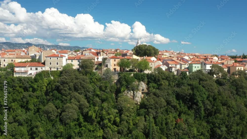 Aerial view of the old town of Omisalj on high rock, Krk island, Kvarner, Croatia, drone reveal footage
Aerial view of the old town of Omisalj on high rock, Krk island, Kvarner, Croatia, drone reveal footage
