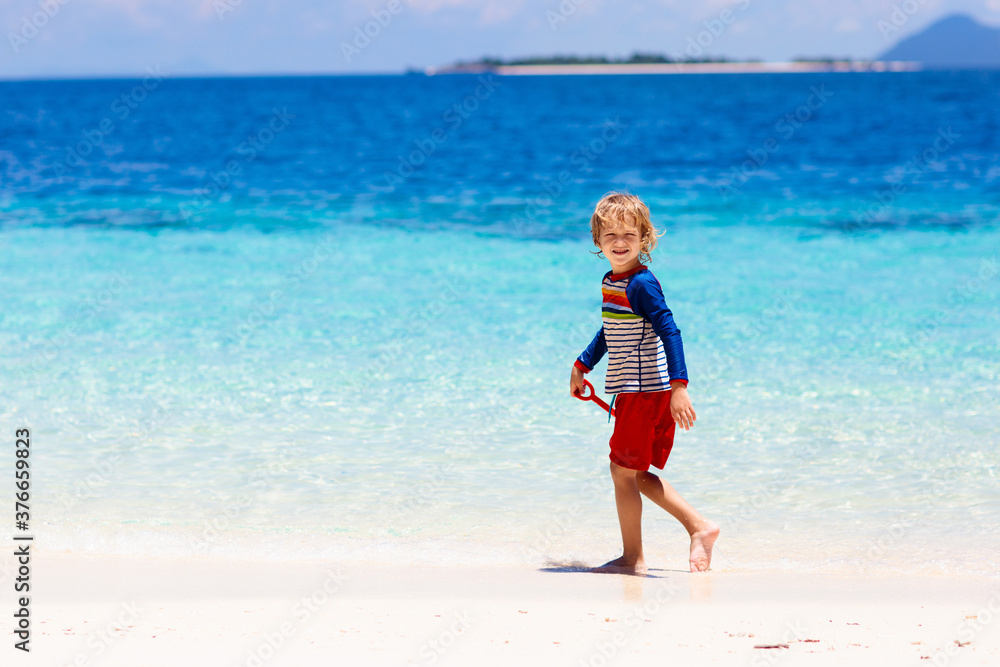 Kids playing on beach. Children play at sea. Kids playing on beach. Children play at sea.