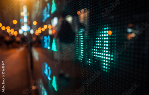 Financial stock exchange market display screen board on the street, selective focus photo