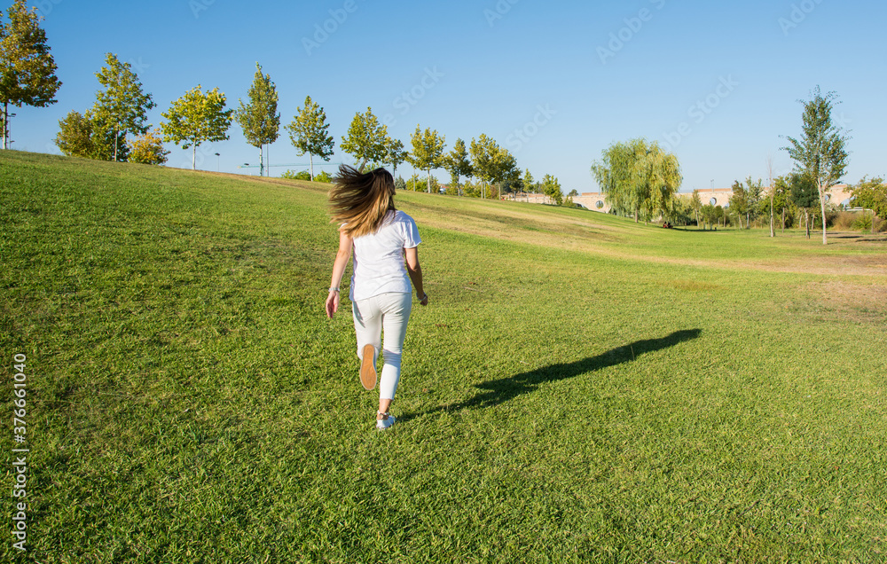 Funny young woman running through the field. Nature lifestyle. Funny young woman running through the field. Nature lifestyle.