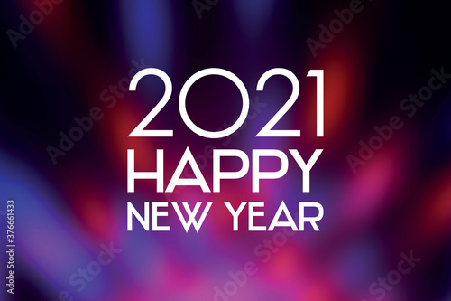 2021 Happy New Year festive purple background stock images. 2021 New Year sign on a blurred purple shiny background. Happy New Year 2021 red violet greeting card images