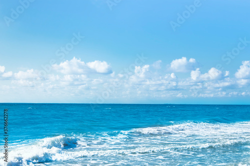 Ocean water with blue sky with clouds. © Юлия Усикова