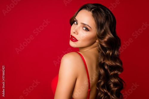 Close-up profile side view portrait of her she nice-looking attractive gorgeous lovely lovable pretty wavy-haired lady vamp posing isolated over bright vivid shine vibrant red color background